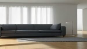 Robô aspirador Electrolux ERB10 realizando a limpeza embaixo de um sofá moderno em uma sala de estar.